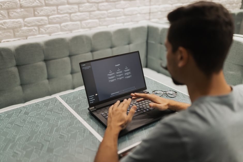 A small business team working inside a single shared AI workspace on a laptop rather than across separate tools